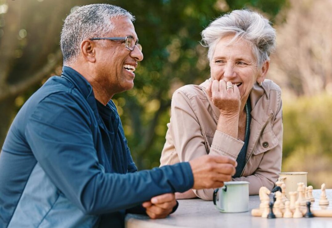 Older adults talking together outdoors