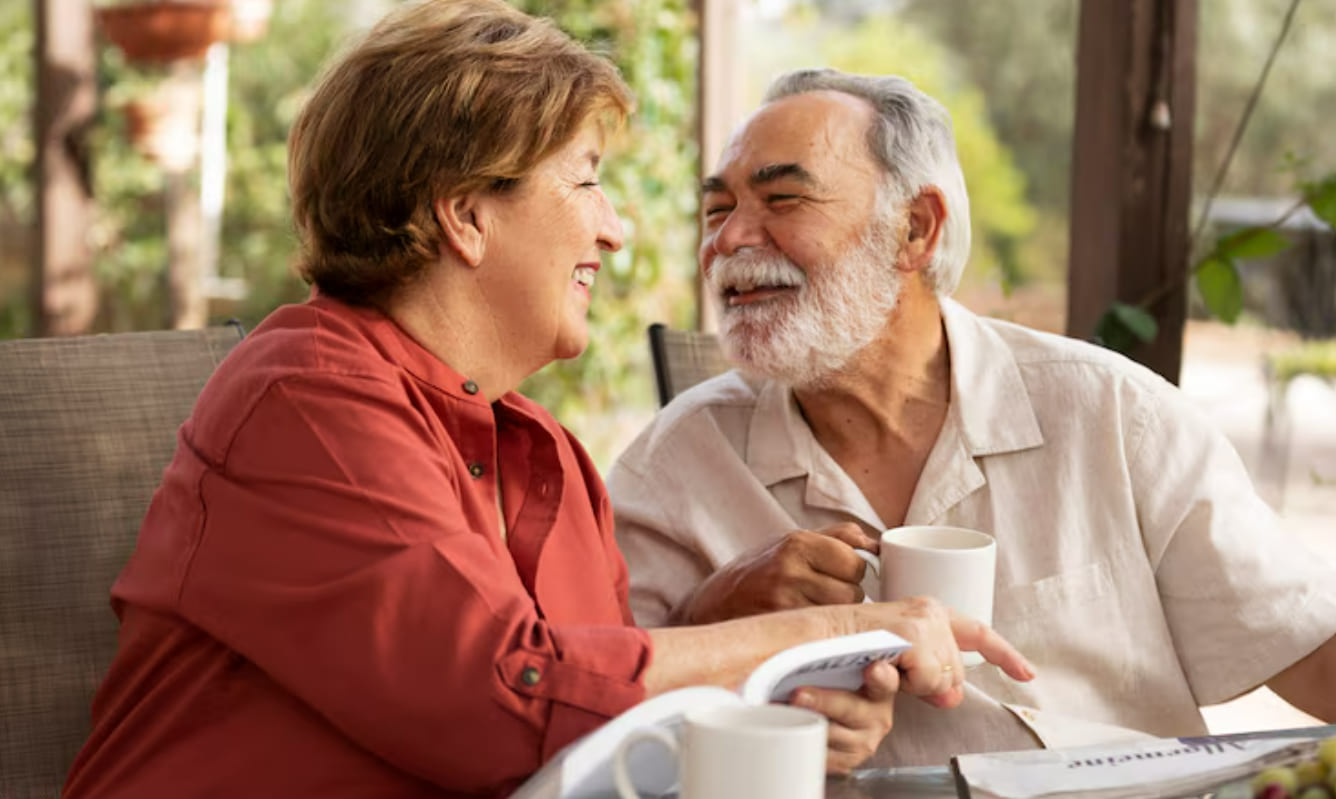 Older couple talking together over coffee